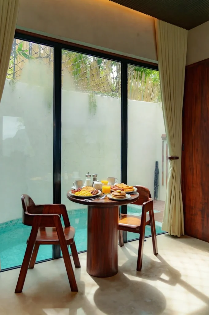 Breakfast for two set beside the glass-enclosed private pool at Alon Villa